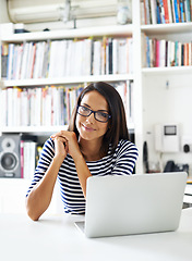 Image showing Portrait, smile and student on laptop in house for remote learning, study or distance education at table. Face, glasses and happy woman on computer at desk, internet and online technology in Brazil