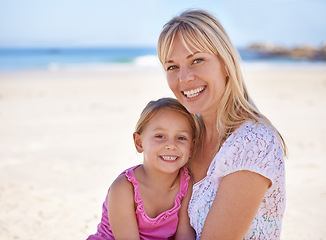 Image showing Portrait, mom and happy child on beach for holiday, summer or kid on vacation to relax in nature. Face, mother or smile of girl at ocean on adventure, travel or family bonding together outdoor by sea