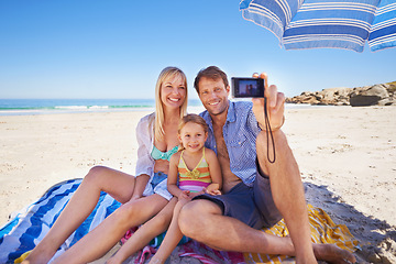 Image showing Happy family, beach and relax with selfie for photography, picture or moment in outdoor nature. Mother, father and child with smile for photo, capture or bonding memory together on the ocean coast
