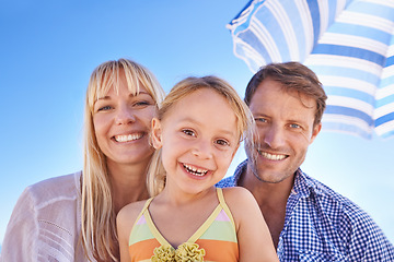 Image showing Happy family, portrait at beach and parents with kid for travel, holiday in Sydney for summer and happy together. Man, woman and young girl with adventure, trust and support with bonding outdoor