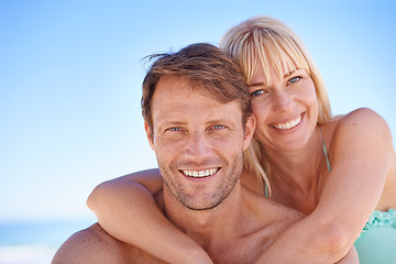 Image showing Love, portrait and happy couple hug at a beach with support, gratitude and bonding in nature together. Travel, face and people embrace at the ocean for adventure, romance and summer, fun or holiday