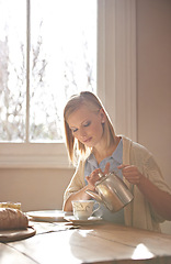 Image showing Woman, pouring and tea in home for morning, calm routine and drink on table. Girl, relax and coffee break with food, snacks or teapot in hands for breakfast preparation on holiday or vacation