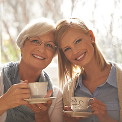 Image showing Portrait, smile and woman with senior mother drinking coffee at breakfast in the morning, bonding and happy in house. Face, elderly mom and daughter with tea cup, love and family at home together