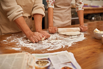 Image showing Dough, recipe and hands of people on table, baking in kitchen and closeup on process in bakery. Person, prepare and press bread with flour, meal prep and working with information or guide from book