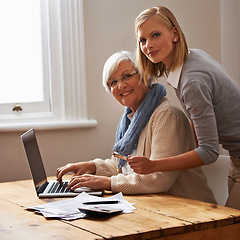 Image showing Granddaughter, grandmother and help with laptop for budget, finance and technology with advice and assistance. Women pay bills online, life insurance or tax paperwork with retirement and portrait