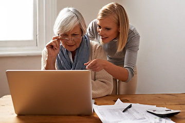 Image showing Granddaughter, grandmother and help with laptop for online payment, finance and technology with advice on budget. Women pay bills, life insurance or tax paperwork with retirement and assistance