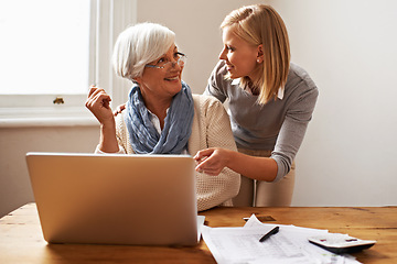 Image showing Granddaughter, grandmother and helping with laptop for online payment, finance and technology with advice on budget. Women pay bills, life insurance or tax paperwork with retirement and assistance