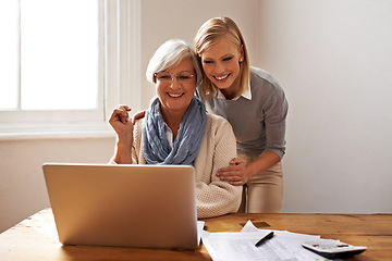 Image showing Woman, senior mother and laptop for finance in home, support and help for ecommerce on website. Daughter, old person and paperwork for tax return, investment and teaching on tech for online banking