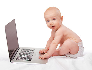 Image showing Baby, laptop and studio for entertainment, fun and games in child development and progressive technology. Infant, happy and toddler for home, diaper and white background for playful and portrait