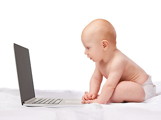 Image showing Baby, laptop and studio for entertainment, fun and games in child development and online technology. Kid, happy and newborn for home, diaper and white background for playful and watch screen