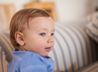 Image showing Baby boy, smile and face profile in sofa relaxing, resting and sitting in living room. Adorable child, growth and development at home kid or infant, happiness and casual outfit or clothes in house