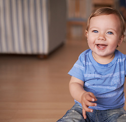 Image showing Boy, baby and smile for curiosity in home, joy and kid to relax in living room on floor. Child development, happy toddler and calm or comfortable, wellness and weekend for health and positive growth