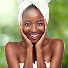 Image showing Hair towel, black woman portrait in studio for skincare, wellness or dermatology results on green background. Beauty, cleaning and face of African lady model with cosmetic, pamper or spa aesthetic