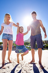 Image showing Parents, swing and holding hands with child at beach in portrait with care, love or bonding in summer on holiday. Father, mother and daughter with games, connection or playing in sunshine on vacation