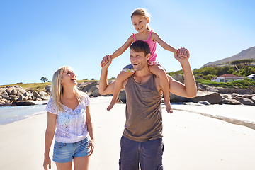 Image showing Happy family, beach and piggyback with child for fun summer, holiday or outdoor weekend in nature. Mother, father and little girl with ride on shoulders in freedom, bonding or love by the ocean coast