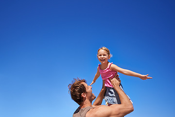 Image showing Fly, father and girl with happiness, airplane and weekend with family, sky background and smile. Outdoor, nature and dad carrying daughter with wellness and energy with summer, freedom and vacation
