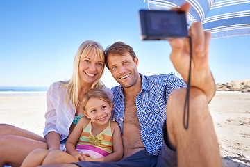 Image showing Happy family, beach and relax with selfie for photo, moment or photography in outdoor nature. Mother, father and child with smile for picture, capture or bonding memory together on the ocean coast