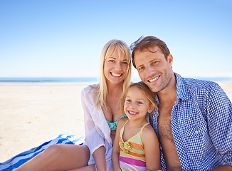 Image showing Portrait, family at the beach and parents with child outdoor, holiday in Sydney for summer and happy together. Man, woman and young girl with hug, adventure and travel, trust and support with bonding