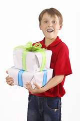 Image showing Boy carrying gifts