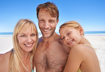 Image showing Portrait, family at the beach and parents with kid outdoor, holiday in Sydney for summer and happy together. Man, woman and young girl with hug, adventure and travel, trust and support with bonding