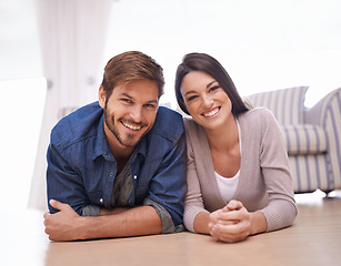 Image showing Couple, living room and floor with portrait, smile and sofa with lounge and relationship. Man, woman and apartment with happiness, love and bonding with dating and relax with romantic positivity