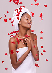 Image showing Happy, skincare and black woman with red petals, dermatology and treatment on a white studio background. Wellness, African person and model with natural beauty and grooming with luxury and aesthetic