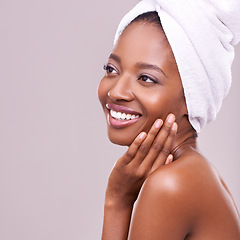 Image showing Black woman, mockup and hair towel in studio with skincare, wellness or beauty on purple background. Makeup, cleaning or hands on face of happy female model touching soft, skin or cosmetic results