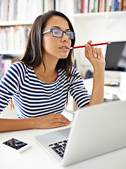 Image showing Student, woman and laptop at library at college, thinking or stress with problem solving for education. Girl, person and computer at university for learning, research or bite pencil to study for exam