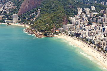 Image showing Coastline, seaside or drone with ocean, city or environment with holiday or getaway trip with nature. Travel, earth or clouds with water or waves with landscape or buildings with beach or aerial view