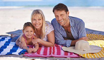 Image showing Portrait, smile and beach with family, holiday and summer with weekend break and getaway trip. Face, parents and mother with father or daughter with vacation and seaside with ocean or tropical island