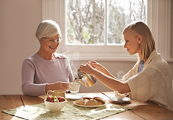 Image showing Happy, grandmother and woman with tea in home for brunch, bonding or visit in retirement. Senior, grandma and girl on coffee break with food, conversation and pouring liquid with steam in morning