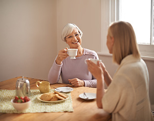 Image showing Happy, grandmother and tea in home with woman at brunch bonding on visit in retirement. Senior, grandma and girl on coffee break with food, conversation and relax on holiday or vacation in morning