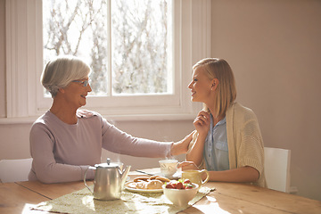 Image showing House, woman and daughter visit mom in kitchen with food for breakfast, tea and snacks with senior. Female person, smile and happiness with mother in family home, elderly and girl in dining room