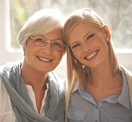 Image showing Senior mother, daughter and happiness for bonding in portrait at nursing home for visit and conversation with love. Mature woman, lady and together with affection or care, family and embrace with hug