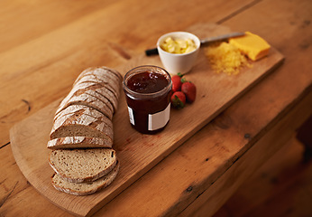 Image showing Breakfast, charcuterie and cheese with jam, bread and fresh strawberry for diet, nutrition and gourmet morning snack. Food, fruit and high angle of sweet, savory and delicious rustic brunch on board.