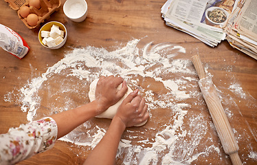 Image showing Chef, hands and recipe for dough on table, baking in kitchen and above process in bakery. Person, prepare and press bread with flour for meal prep and learning information from guide in book