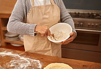 Image showing Hands, baking and mixing bowl with woman in kitchen of home to stir ingredients for culinary recipe. Cooking, food and preparation with senior person in apartment as chef for pastry preparation