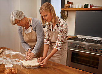 Image showing Mature, mother and baking in kitchen with woman, helping with dinner and meal prep together. Senior, mom and person in home learning about family recipe with flour, dough and prepare pie in dish