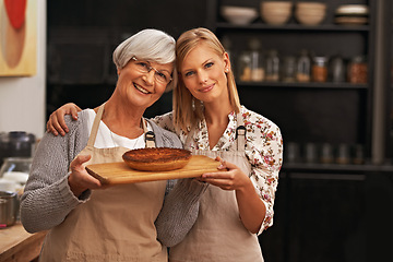 Image showing Portrait, happy woman and elderly mother with pie in kitchen, cooking or smile of family showing homemade food together in house. Face, daughter or senior mom with dessert, pastry or help with baking