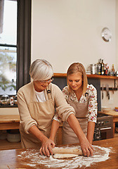 Image showing Family, baking and grandmother in kitchen with ingredients and young lady for teaching and cooking together. Senior citizen or elderly person with apron and smile at home for food or dessert