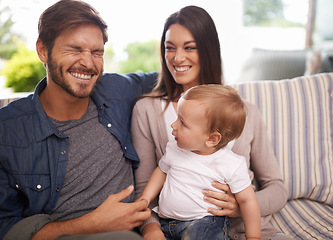 Image showing Happy family, smile and relax in sofa mother, father and child at home together. Married couple, parents and playing with baby boy for laughing, bonding and embrace relationship in living room