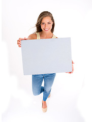 Image showing Model, poster and portrait with smile, above and happiness with space. Woman, studio and high angle with fashion, mockup and confidence for presentation or working isolated on white background