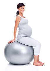 Image showing Maternal woman, ball and studio for portrait trimester, wellness and exercise for motherhood. Pregnant female person, workout and white background for health, fitness and pregnancy to keep in shape