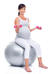 Image showing Portrait, pregnant and mother on ball for fitness, wellness and training for expectant mom on white background. Female person, pregnancy or woman with dumbbells for exercise, health or yoga in studio