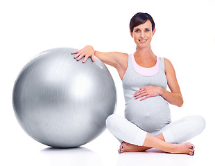 Image showing Pregnant female person, ball and studio for pilates, wellness and exercise for motherhood. Maternal woman, workout and white background for health, fitness and pregnancy to keep in shape and balance