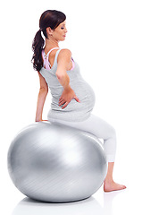 Image showing Woman, pregnant and mother with ball for fitness, exercise and training in pregnancy on white background. Female person, expectant mom and model on pilates sphere for wellness, health and yoga