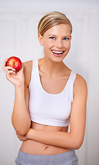 Image showing Happy woman, portrait and diet with apple for nutrition in fitness, health and wellness at home. Face of female person with smile and natural organic red fruit for vitamin, fiber or snack at house