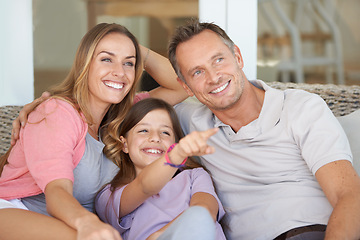 Image showing Mom, dad and child with view on patio together with point to relax on sofa with smile, bonding or care on holiday. Father, mother and daughter for sign with idea, show or direction at family home