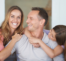 Image showing Parents, girl child and portrait on patio with hug, care and love with dad with smile at family house. Father, mother and daughter with embrace, connection and happy to relax together in backyard