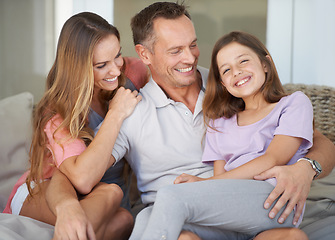 Image showing Parents, girl kid and portrait on patio with hug, care and love with dad with smile at family house. Father, mother and daughter with embrace, connection and happy to relax together in backyard